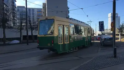 Back of tram with ad for the Chess musical