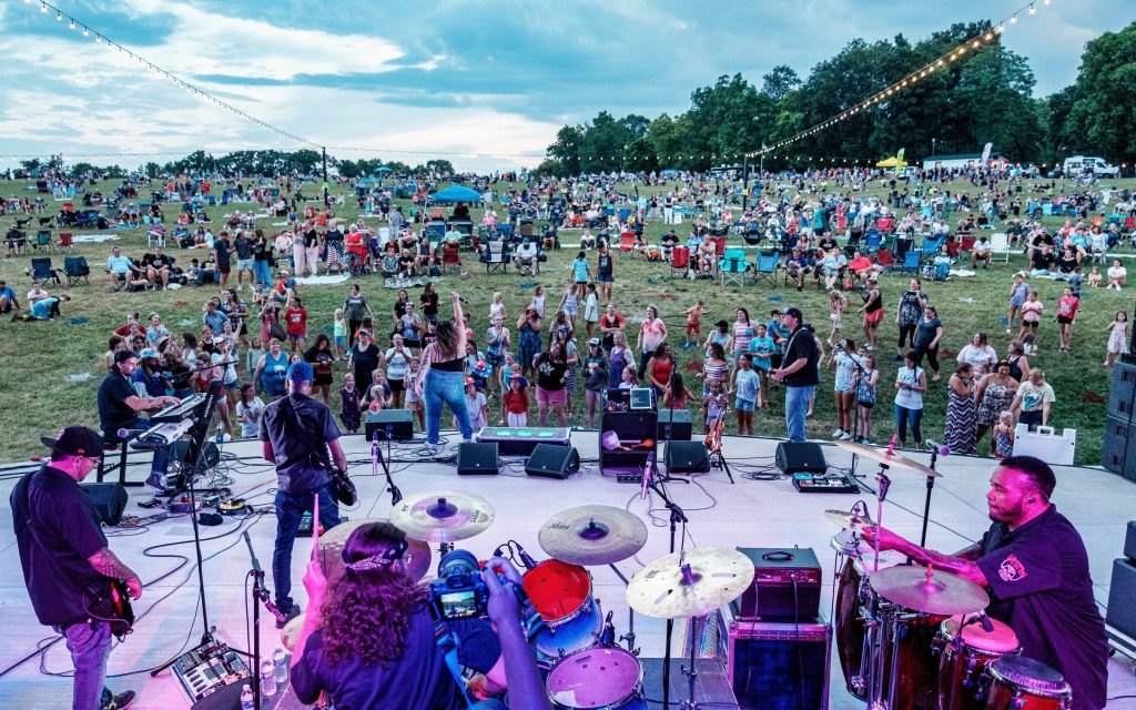 Free outdoor concerts build community through music—including at Levitt AMP Shenandoah Junction, West Virginia, pictured here during a performance by the Kelly Bell Band.